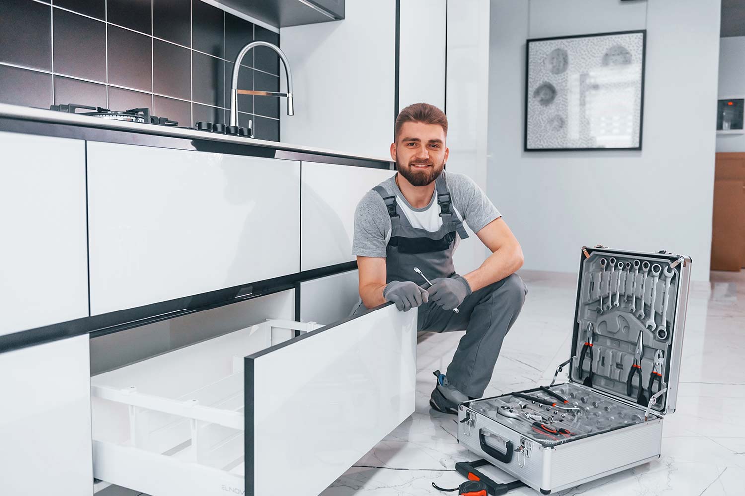 young-professional-plumber-in-grey-uniform-using-e-resize.jpg young-professional-plumber-in-grey-uniform-using-e-resize.jpg